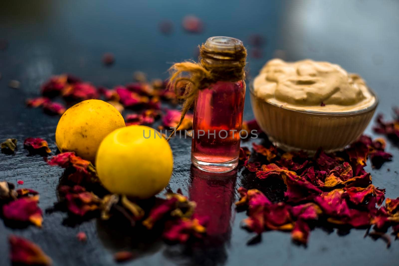 Best cheap DIY face mask for acne scars of multani mitti or fuller's earth or mulpani mitti on the wooden surface consisting of lemon juice, fuller's earth, and some rose water also. by mirzamlk
