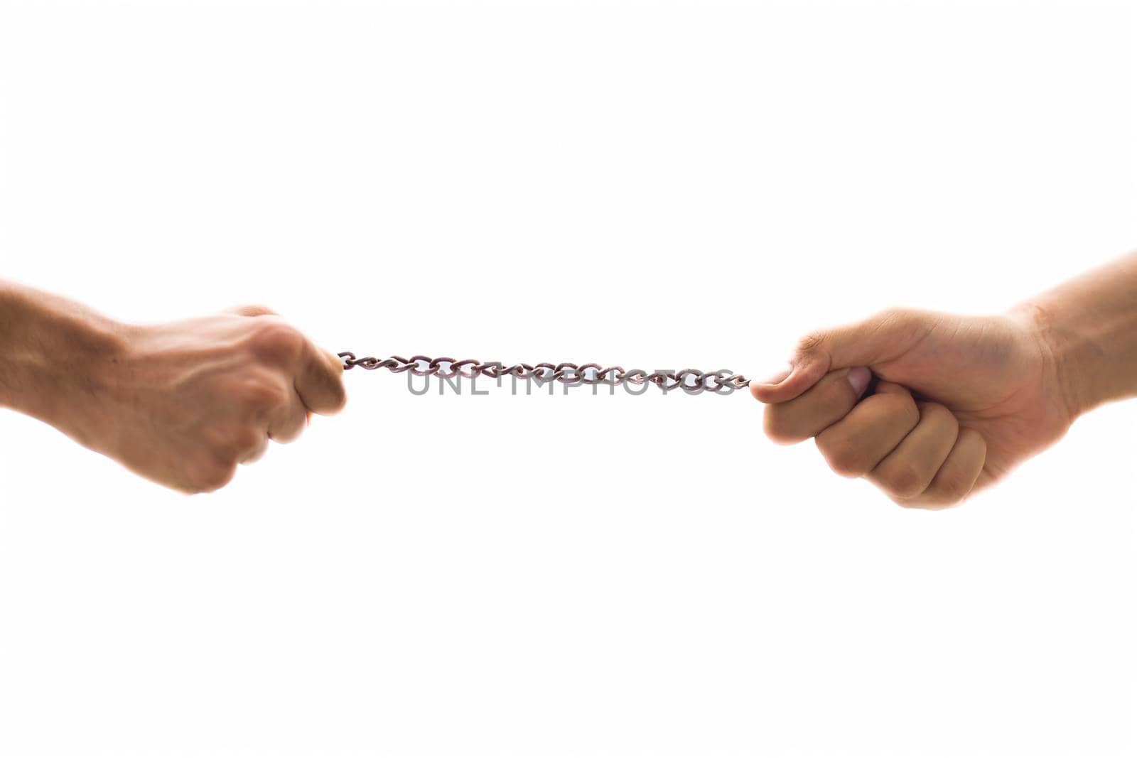 Close up shot of two hands fighting for the piece of chain or playing tug of war game. Concept of making a place in the fields, & competition. Isolated on white.