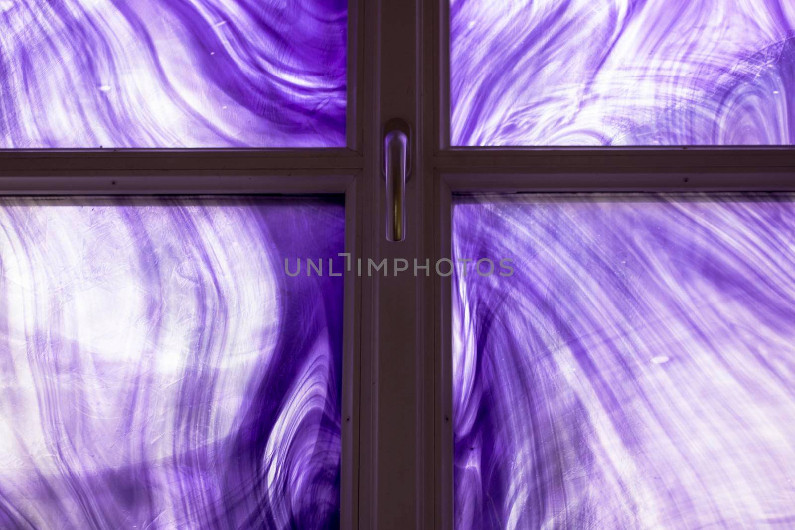 Purple painted glass in a window