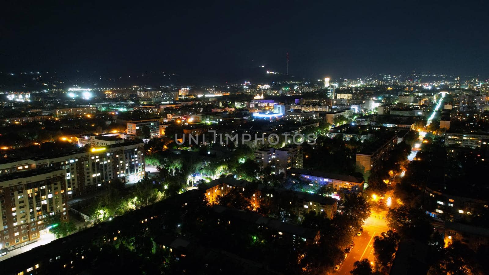 View from the height of the night city of Almaty by Passcal