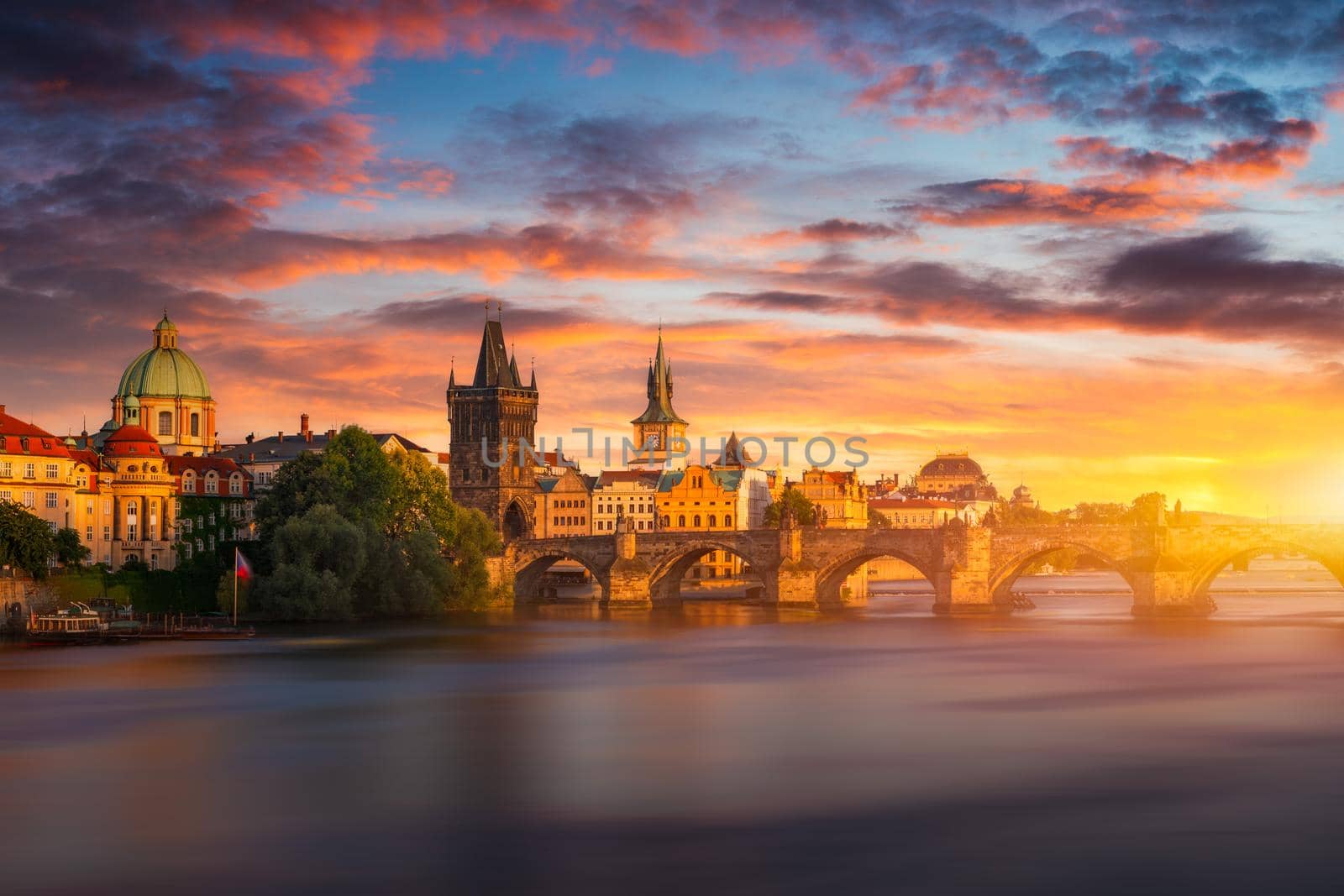 Old town of Prague. Czech Republic over river Vltava with Charles Bridge on skyline. Prague panorama landscape view with red roofs.  Prague view from Petrin Hill, Prague, Czechia.