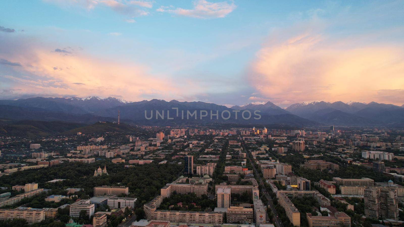 Epic sunset with clouds over the city of Almaty by Passcal