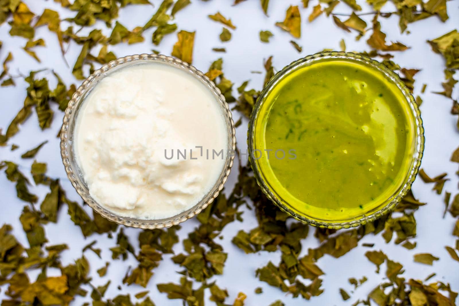 Neem or Indian Lilac face mask isolated on white for acne and scars consisting of gram flour, neem paste, and some curd.