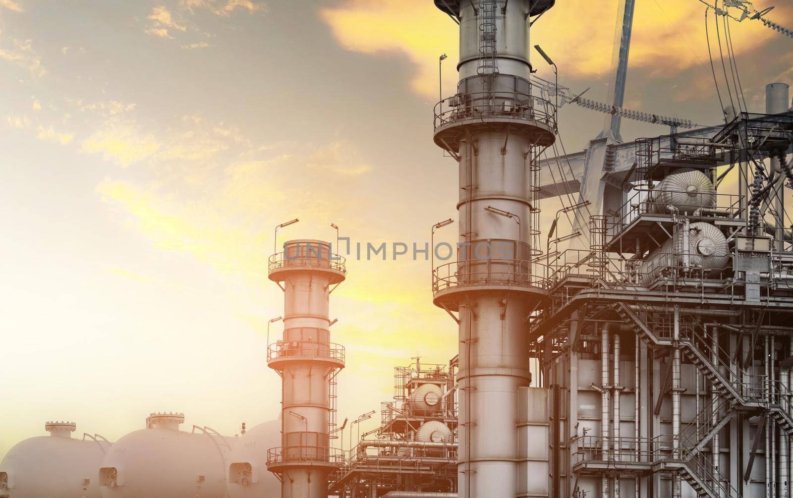 Gas turbine electrical power plant. Global energy crisis concept. Natural gas tank. Industrial gas storage tank. LNG or liquefied natural gas storage tank. Power plants with energy crisis concept.