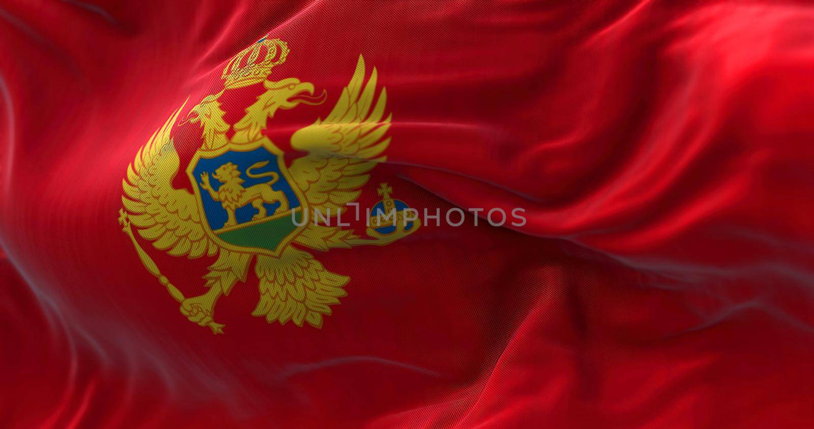 Close-up view of the Montenegro national flag waving in the wind by rarrarorro