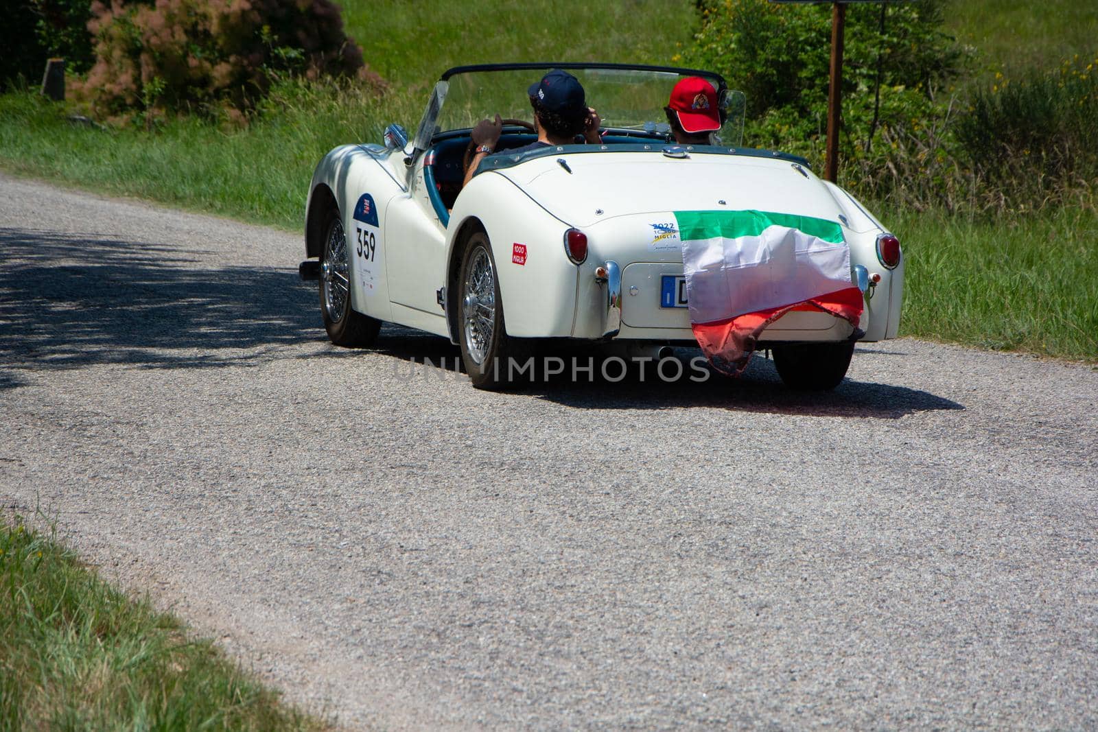 URBINO - ITALY - JUN 16 - 2022 : TRIUMPH TR3 SPORTS 1956 on an old racing car in rally Mille Miglia 2022 the famous italian historical race (1927-1957