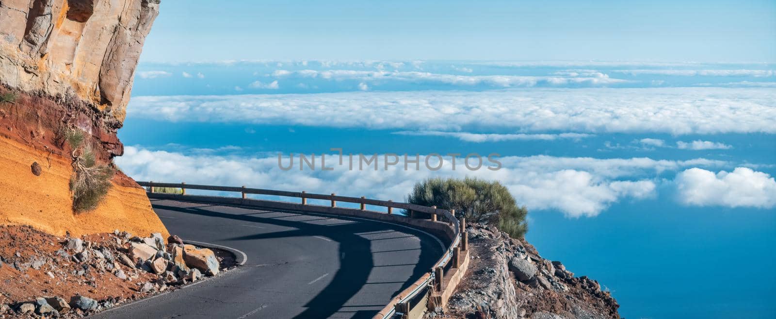 Spectacular high mountain curved road over the clouds