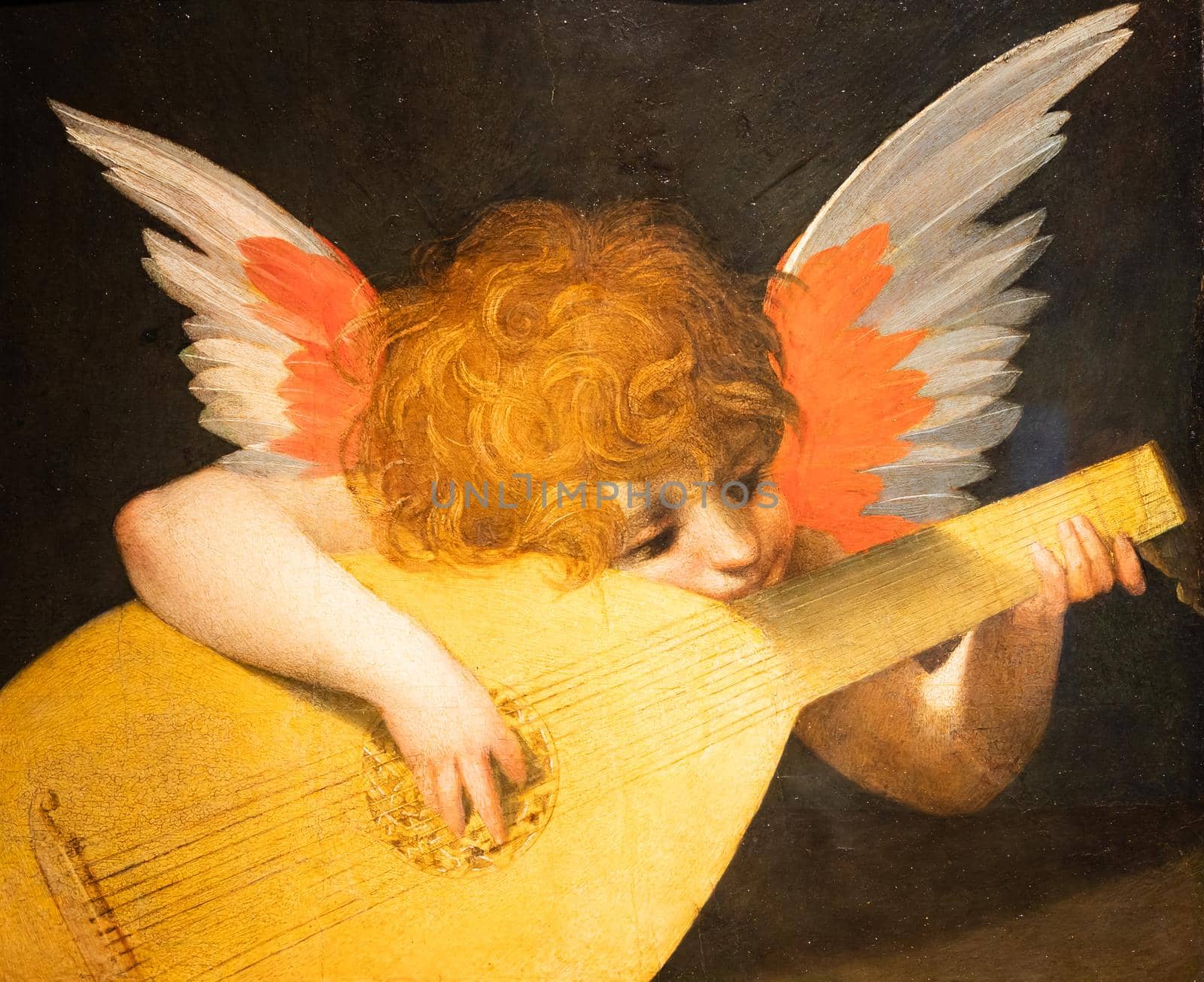 Florence, Italy - Circa August 2021. Angel playing a lute by Rosso Fiorentino, c.1521 - oil on panel