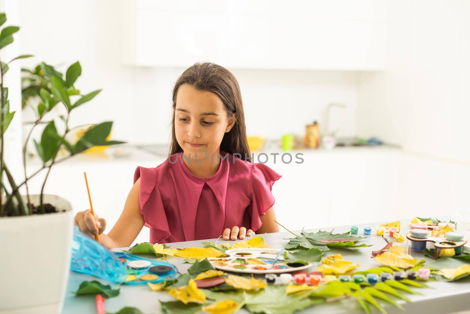 Children's picture made from autumn leaves paint. High quality photo