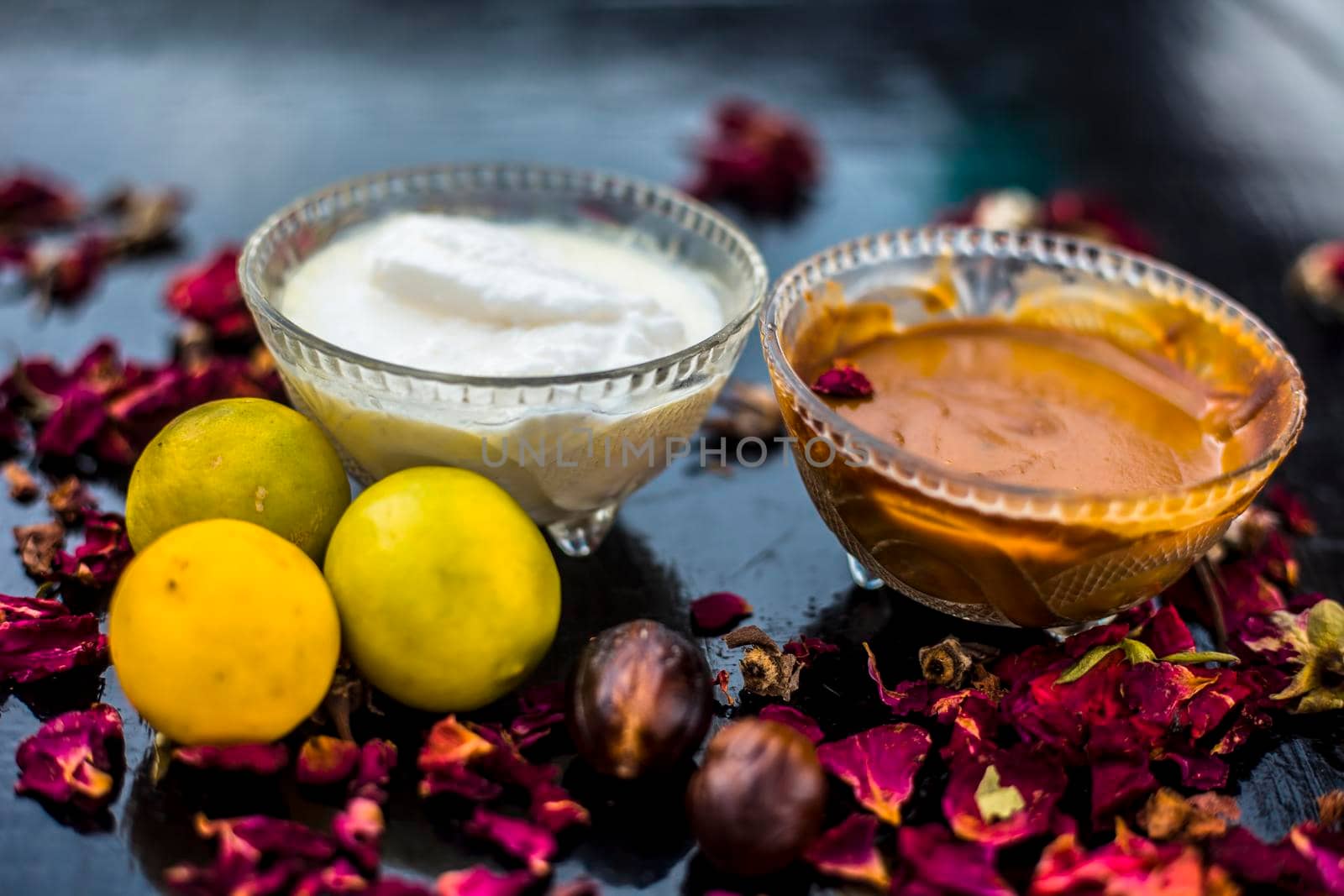 Nutmeg face mask to treat to even out discolorations and pigmentation on your face on the wooden surface consisting of Nutmeg powder, lemon juice, and curd. by mirzamlk