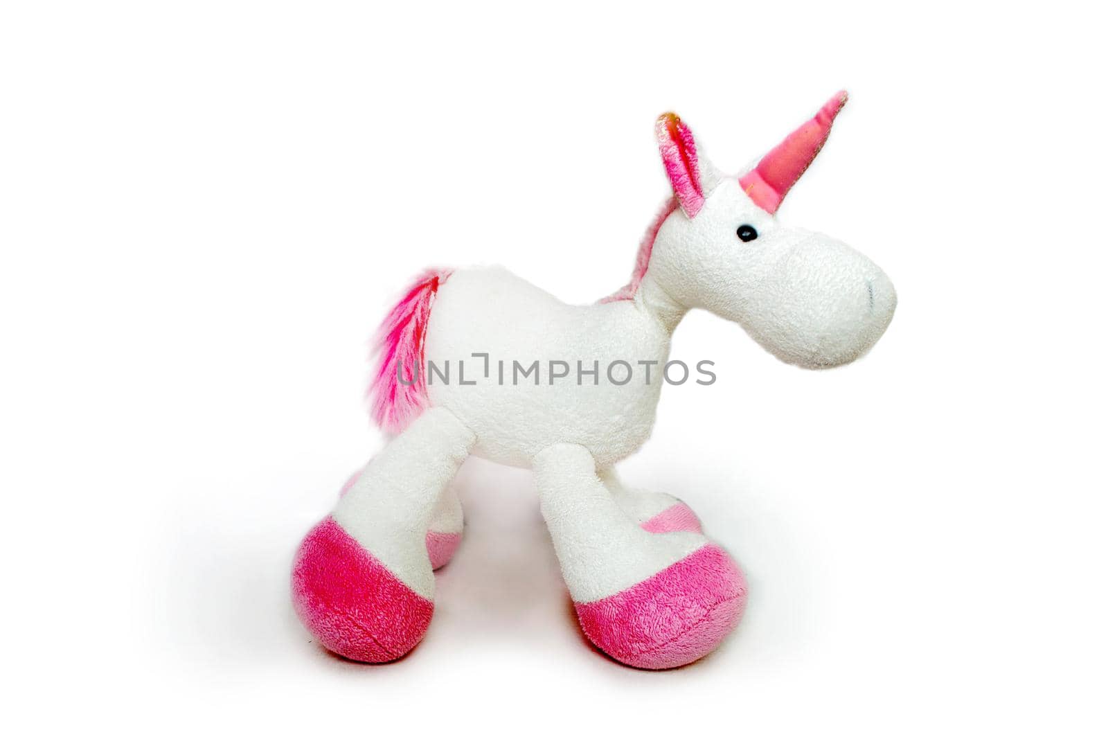 Lovely white pony doll isolated on white background. Adorable teddy bear for decorative. High quality photo