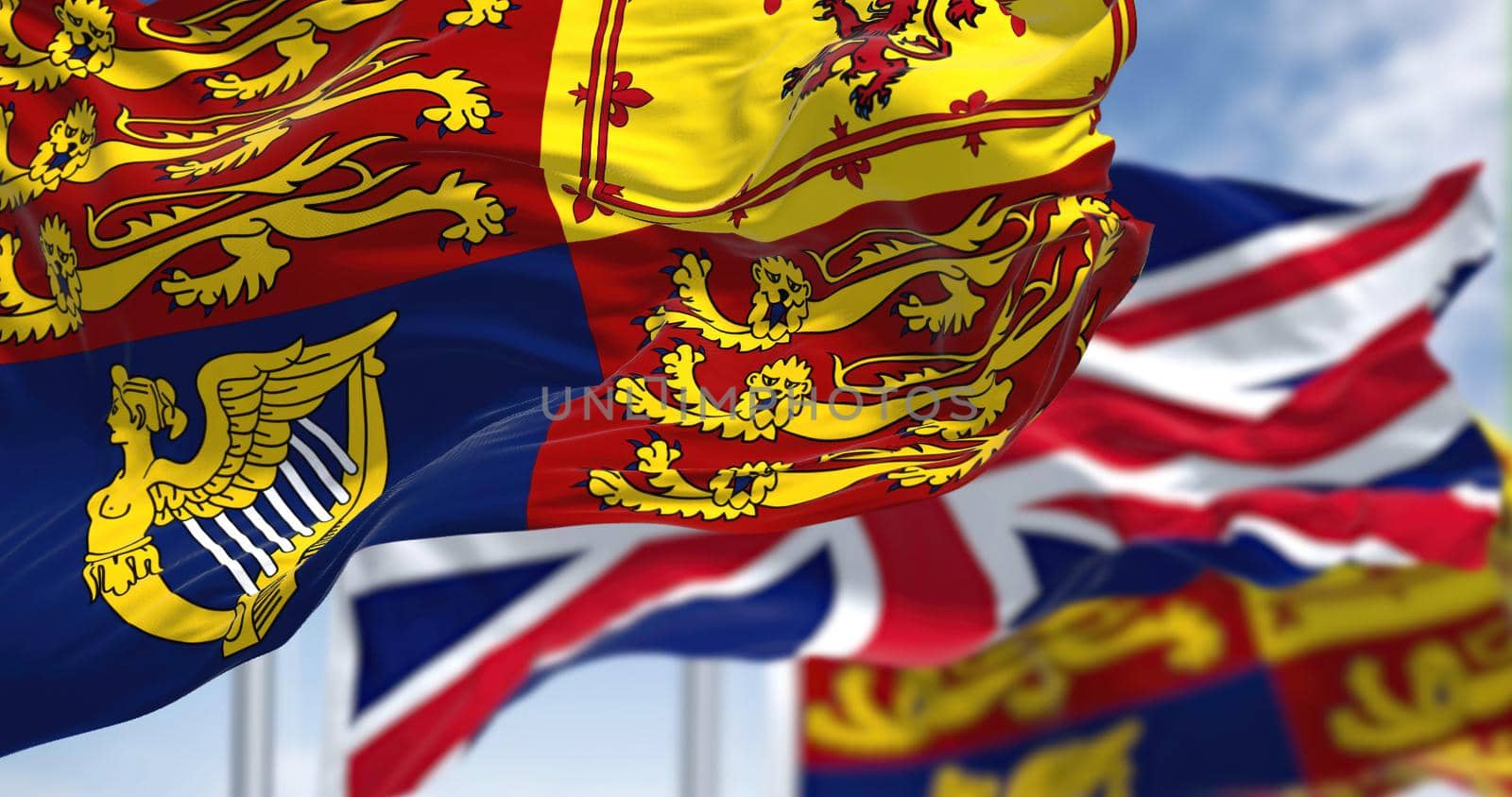 The Royal Standard of the United Kingdom waving the wind along with the UK flag by rarrarorro