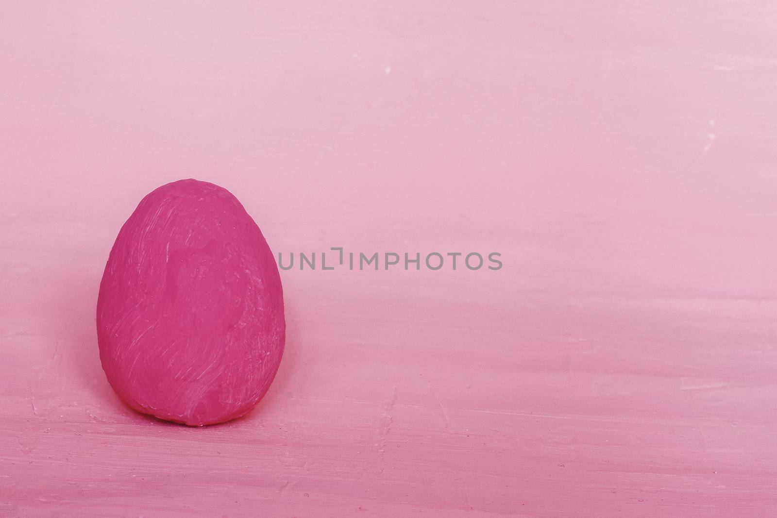 Dark pink decorative egg on a red background. by gelog67