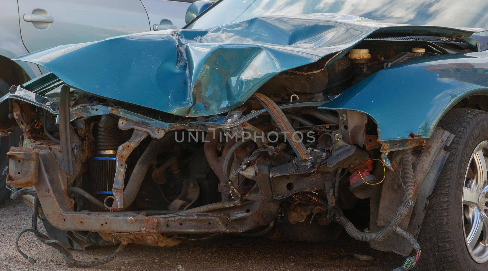 Severely damaged front part of a passenger car. by gelog67