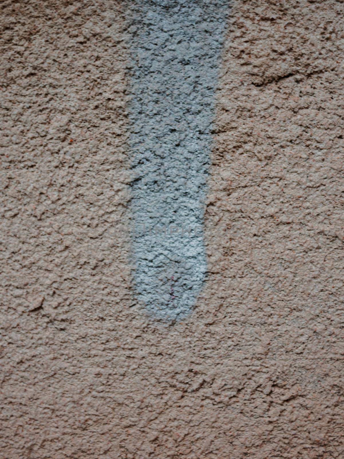 Drip of blue paint on a brown wall. by gelog67