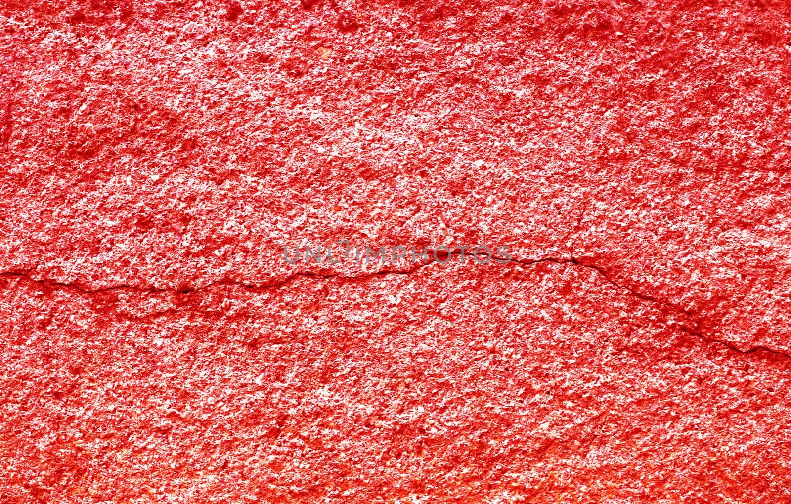 Crack on a concrete wall with red stucco. by gelog67