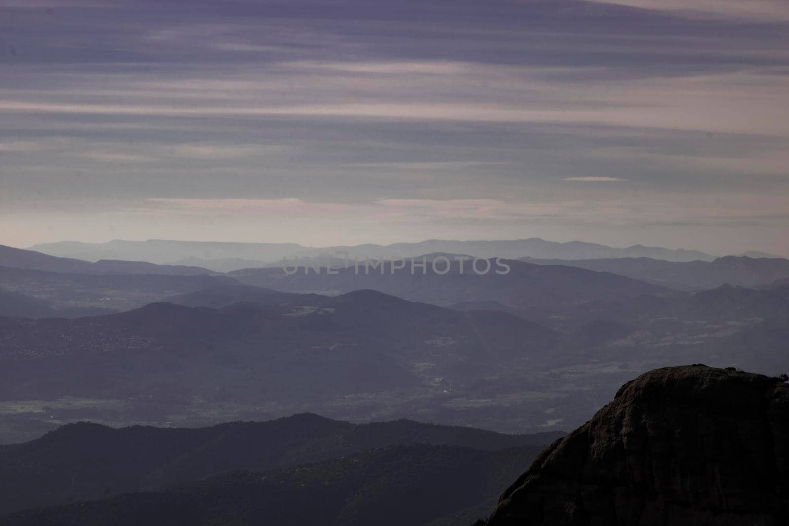 Layers of mountains among the mist view from Montserrat mountain in Catalonia