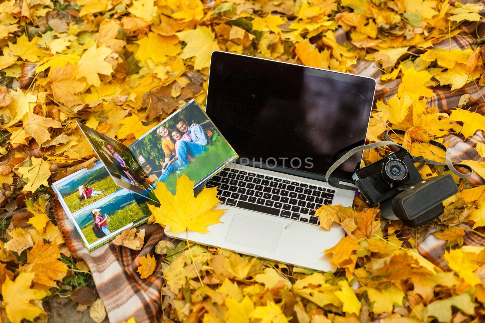 elegant photobook and laptop, autumn photo album