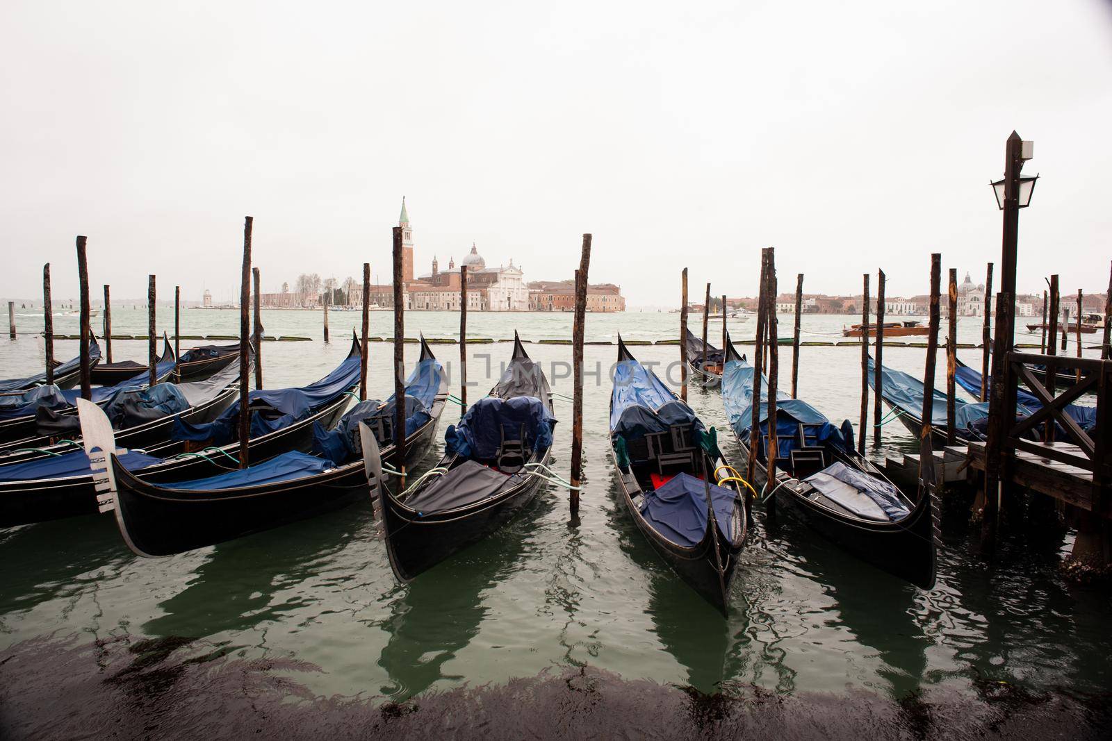 Gondolas parking in the traditional Venetian rowing boat by bepsimage