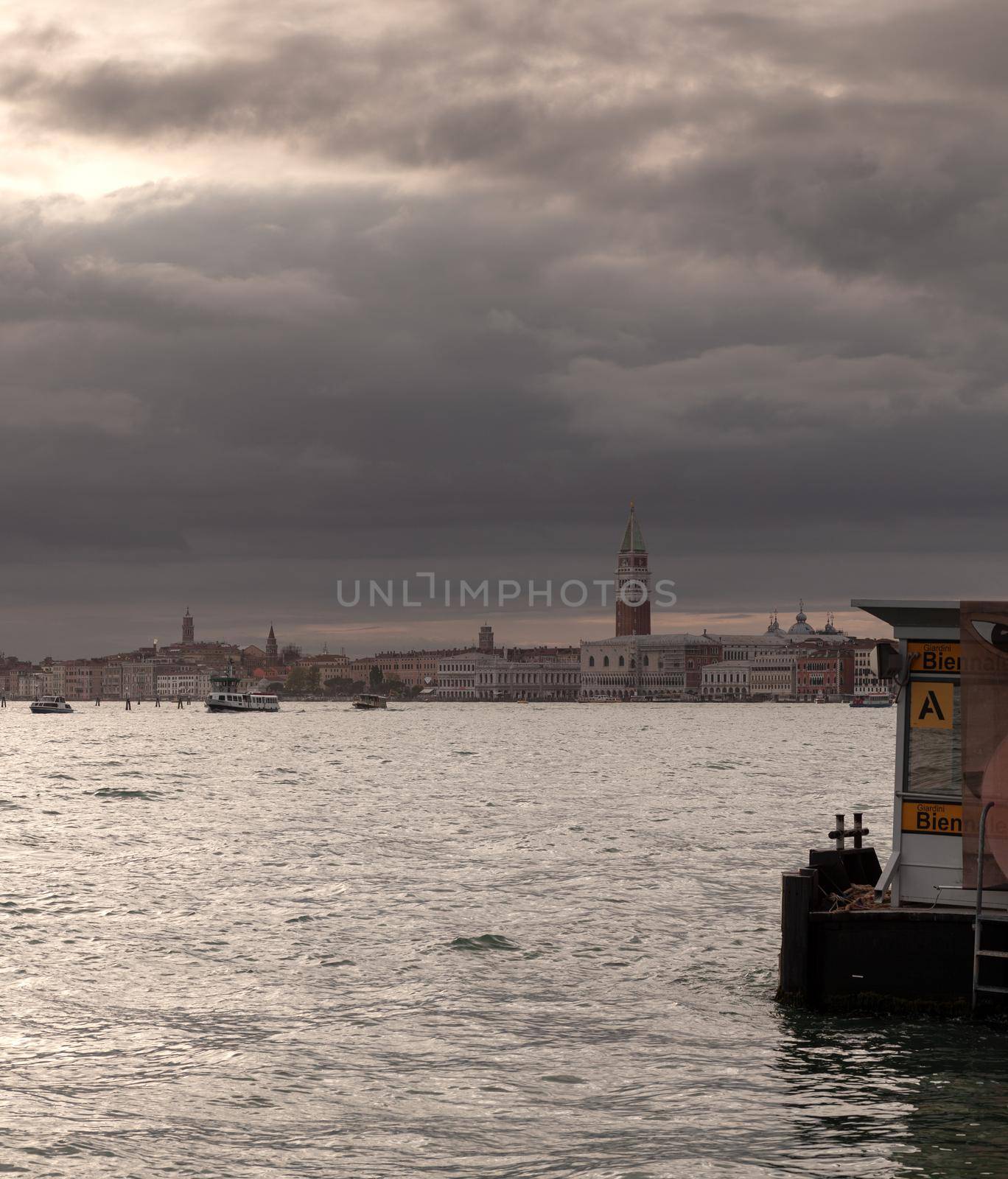 View of the St Mark's Campanile on the cloudy sky by bepsimage
