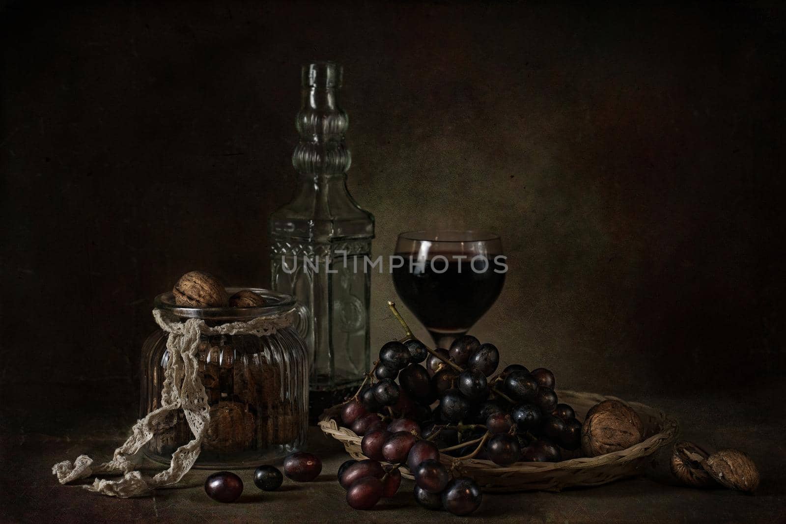 still life of berries and fruits on the table on a dark background photo