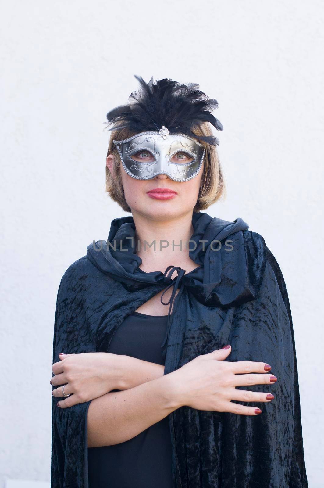 Mysterious Girl in a black cloak and a masquerade mask, mardi gras steampunk mask, a fairy tale, an enchanting story, High quality photo