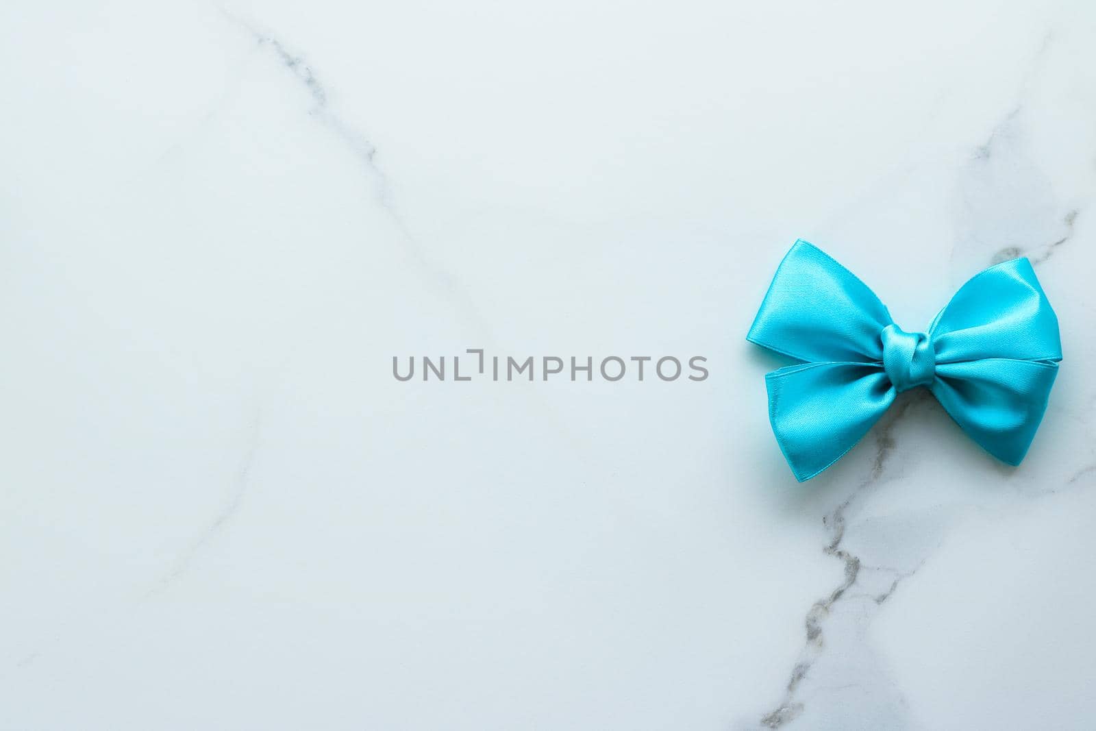 Holiday decor, feminine design and flatlay concept - Blue silk ribbon on marble, top view