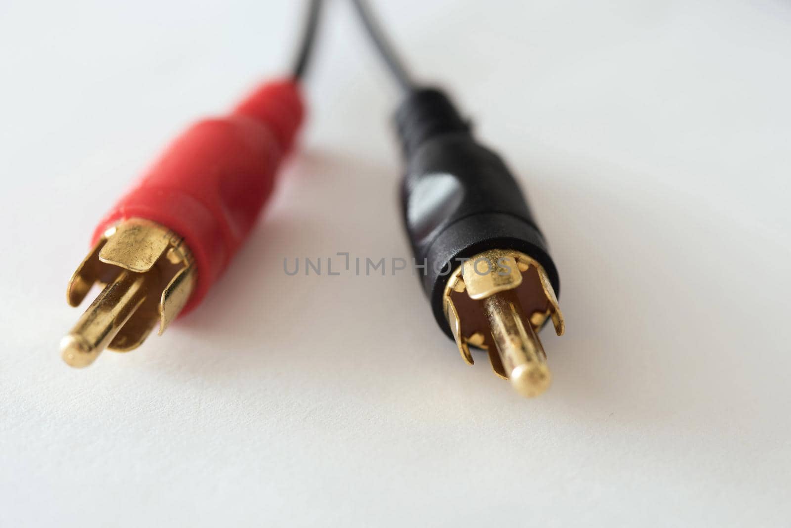 Gold plated connectors in close-up view against white background