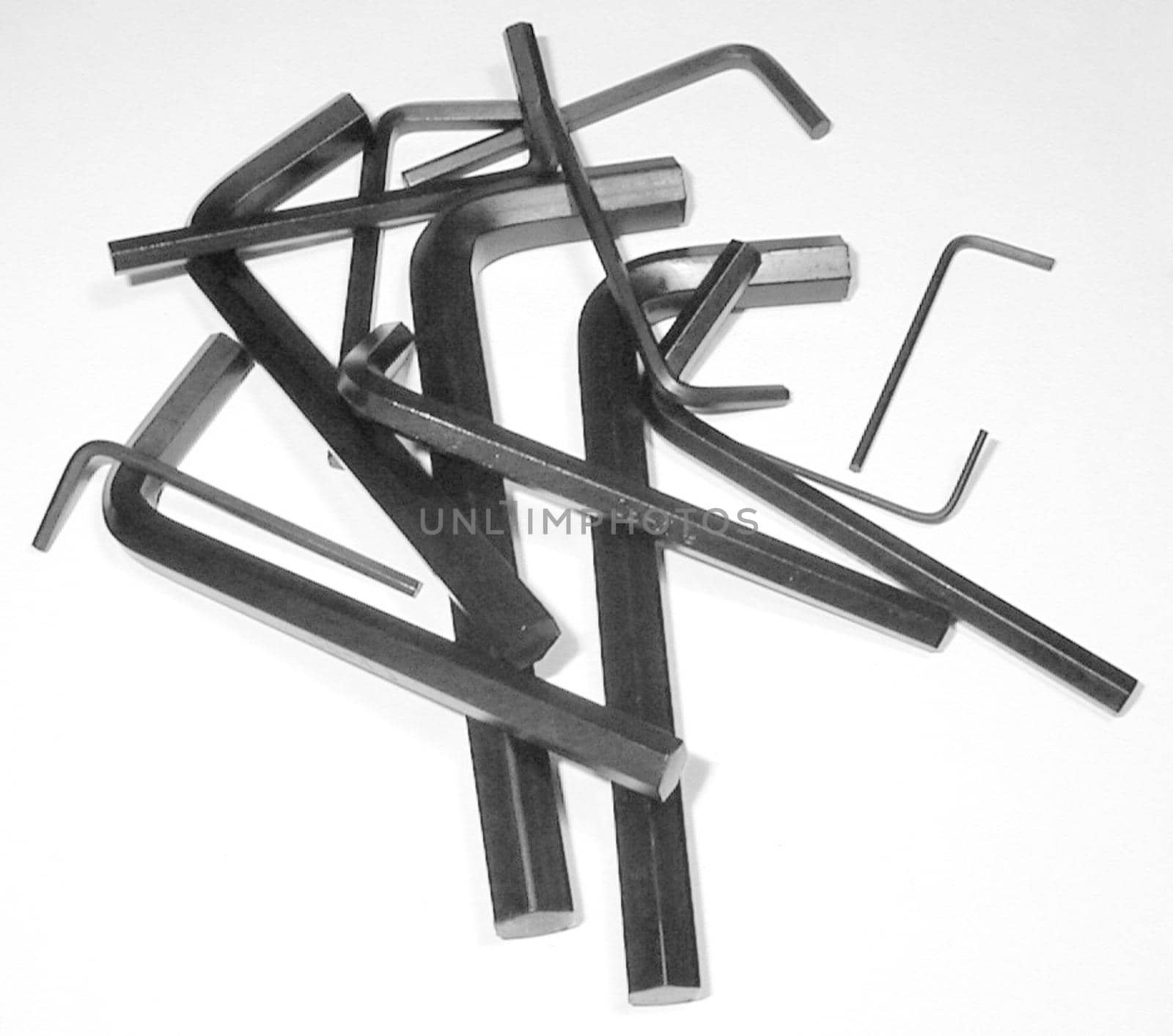 High Angle of Collection of Metal Allen Keys in Various Sizes Jumbled on White Background