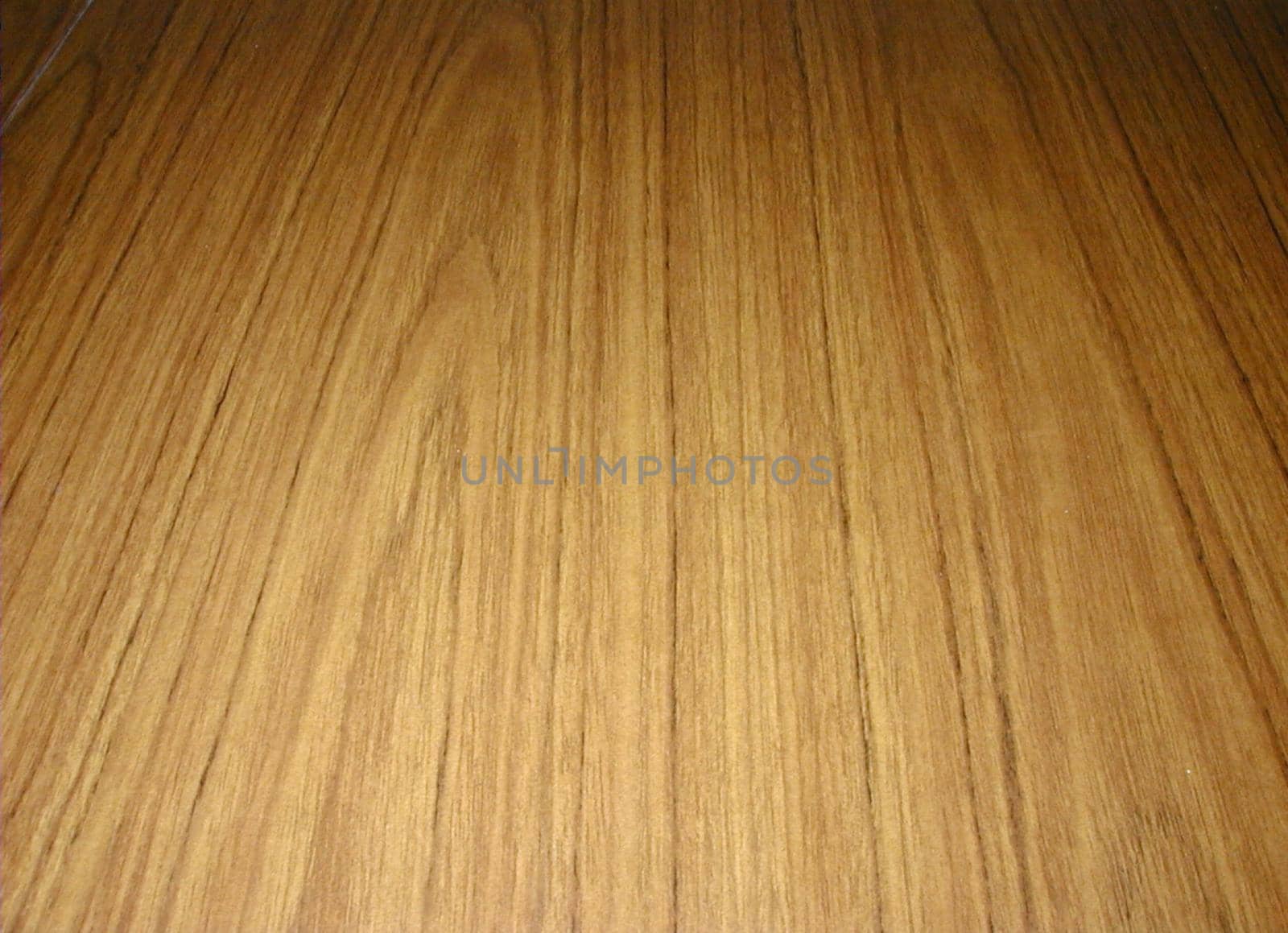 faux wood surface on a sheet of laminate particleboard wood