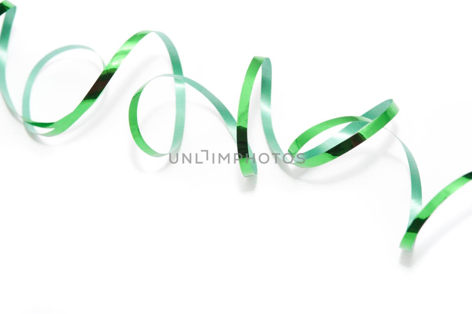 a generic green ribbon background on white could be used for st patricks day or christmas 