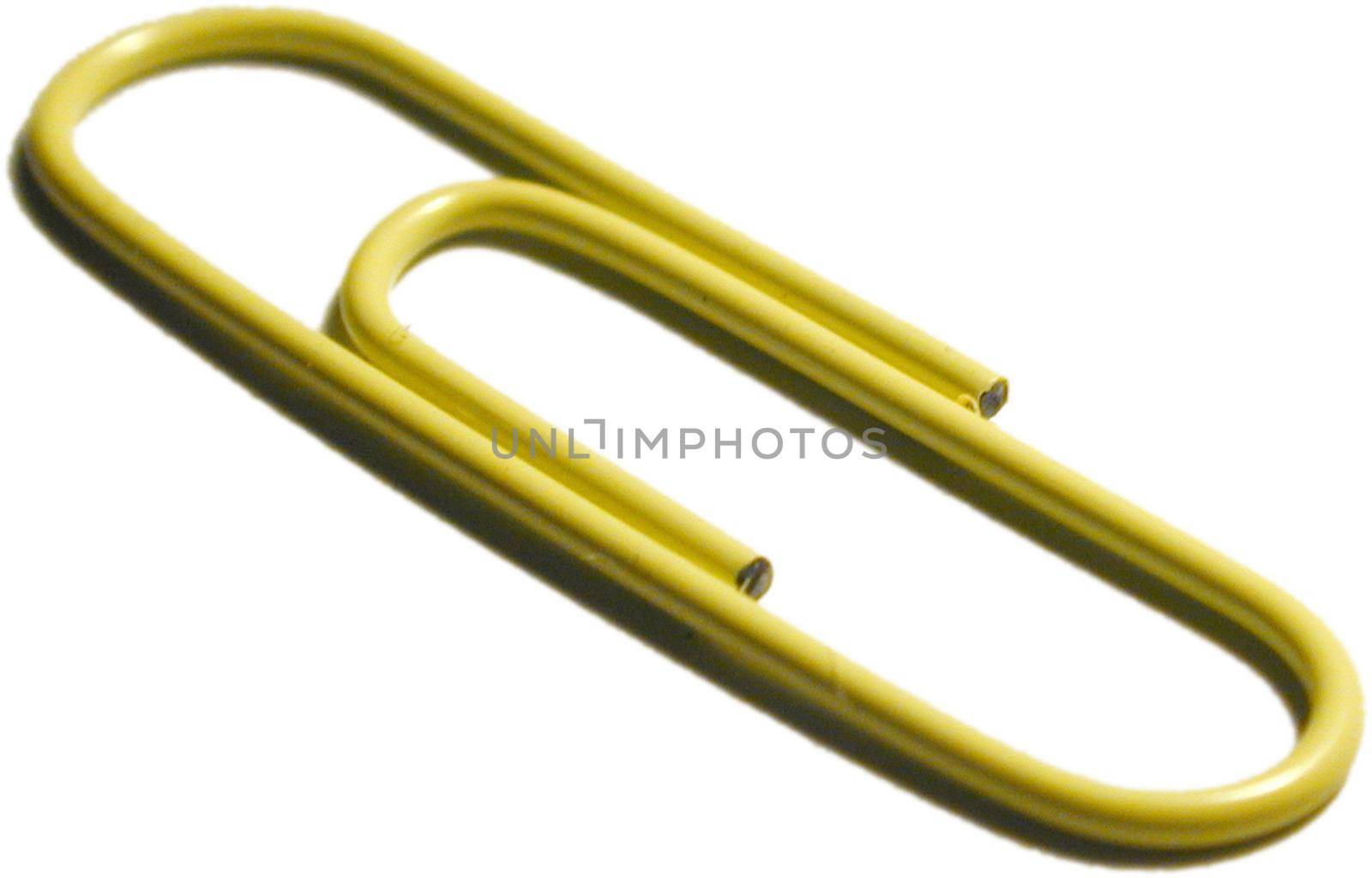 Close up view on a single yellow wire paperclip lying diagonally on a white background for organisation and stationery supplies