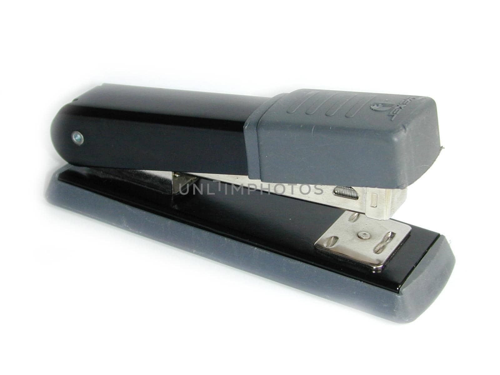 Grey and black office stapler for stapling paperwork with wire staples for filing and organization diagonally on white