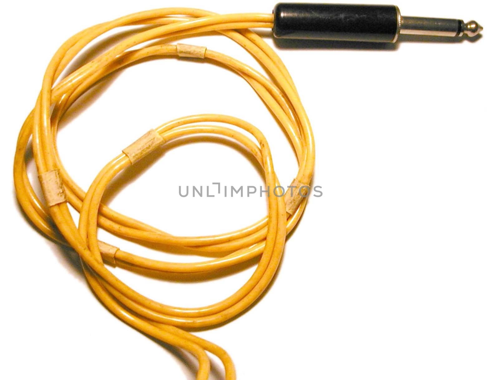 Thick quarter inch yellow audio cord close-up