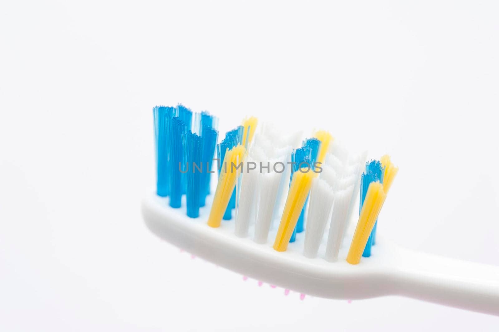 close up view of toothbrush bristles on white background