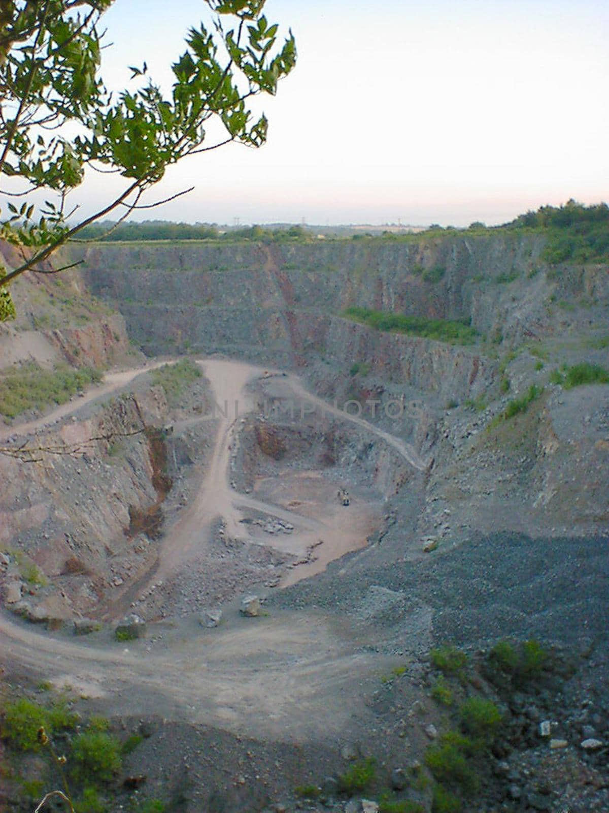 High angle view of pathways and ridges of mined quarry in daylight