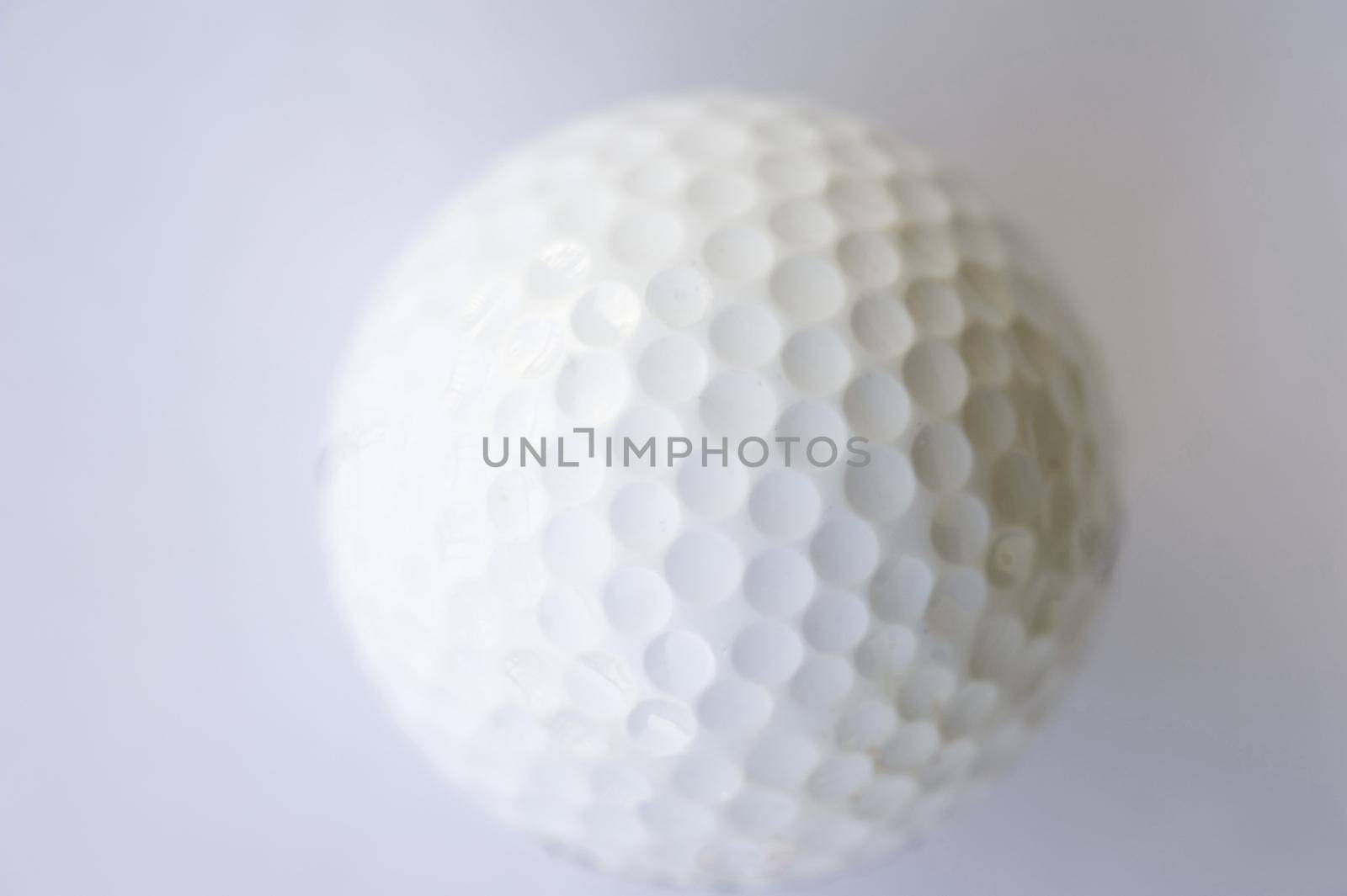 a golf ball on a white background