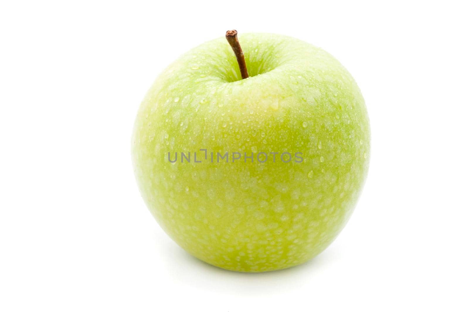 Single fresh green apple with a short stalk for a healthy diet on a white background