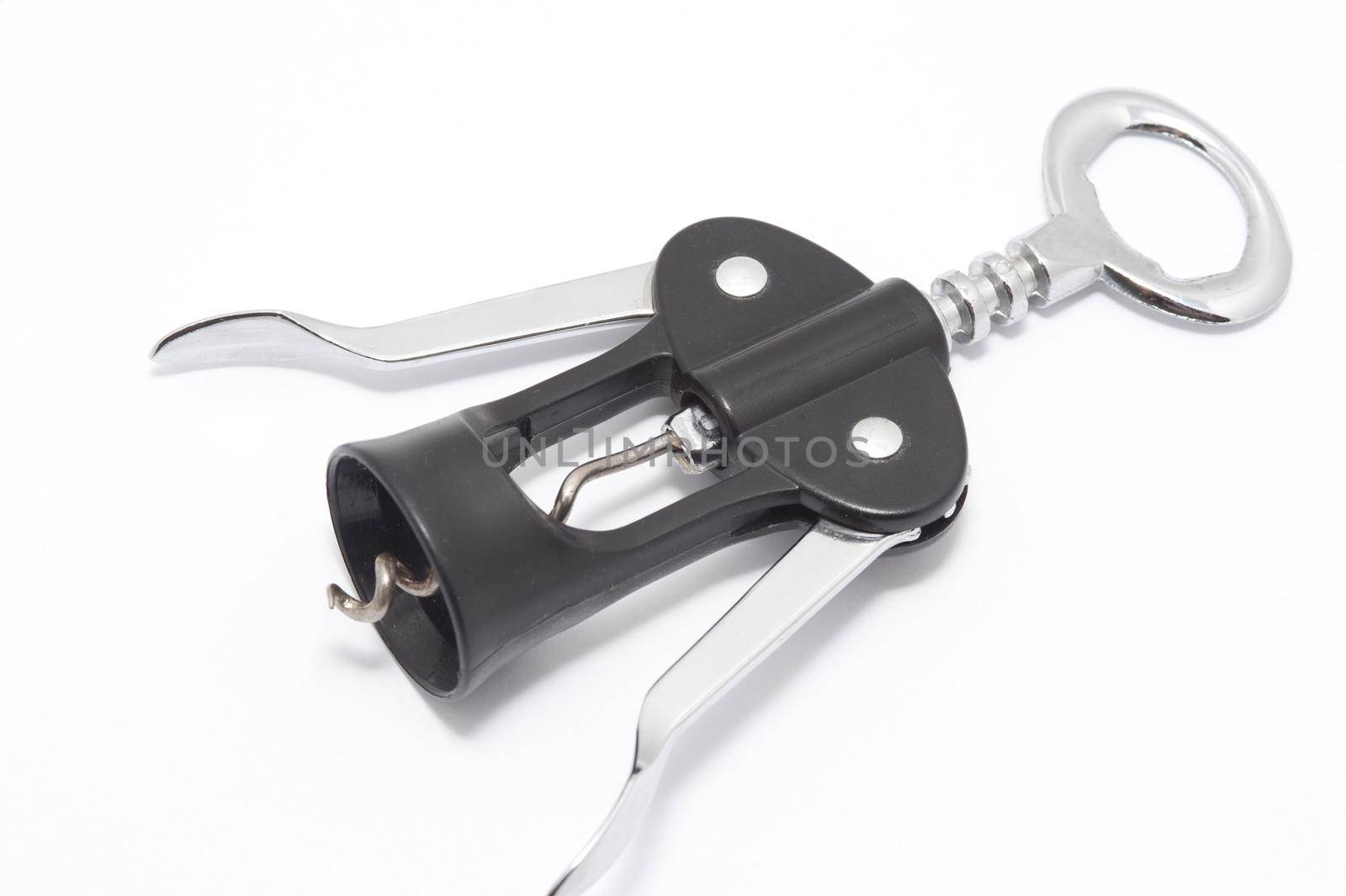 Wine bottle opener with lever mechanism and steel corkscrew lying diagonally on a white background