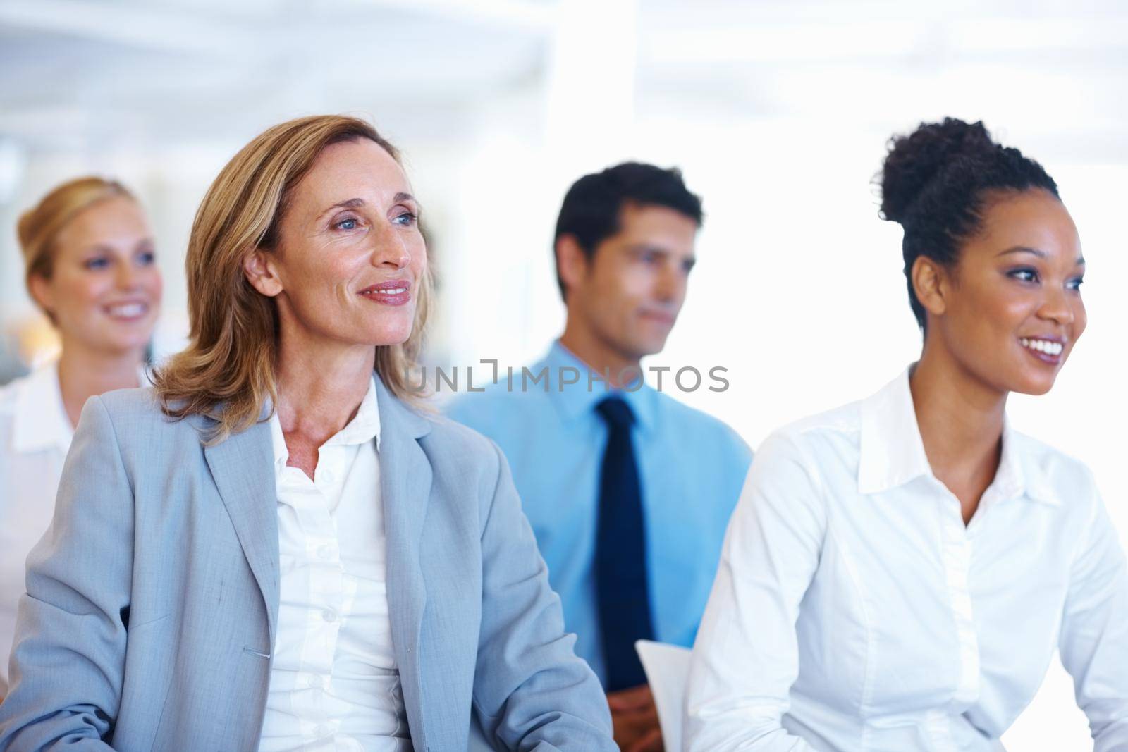 Business people sitting at seminar. Portrait of multi racial business people sitting at seminar