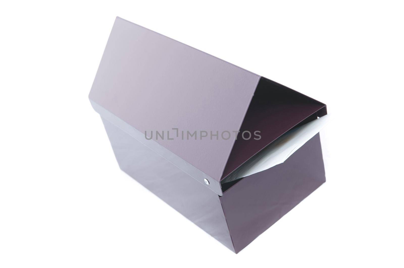 New incoming envelope and letter in a post box in a communication concept, high angle isolated on white
