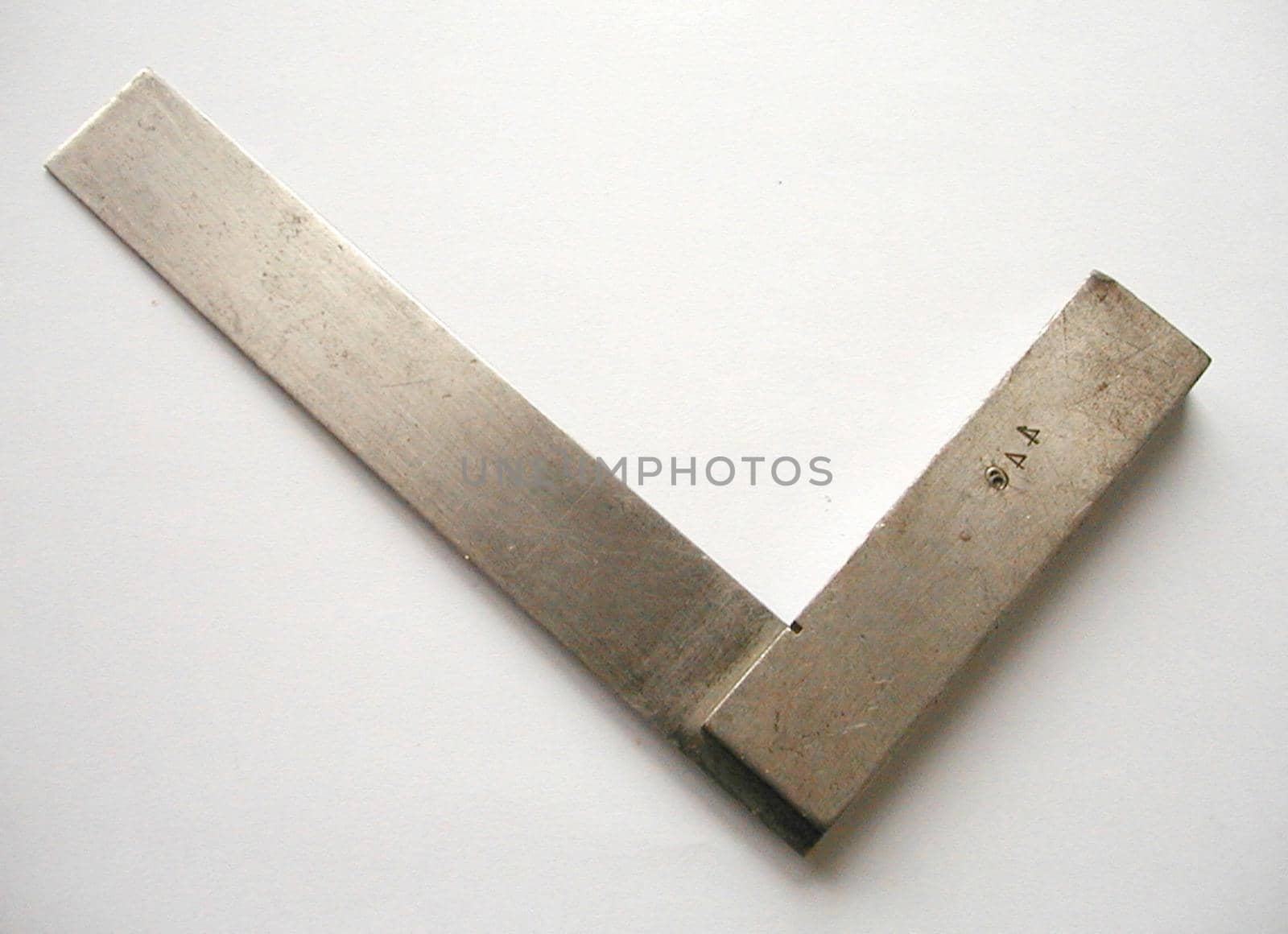 Set square or right angle for use in building to ensure a perpendicular angle lying diagonally on a white background