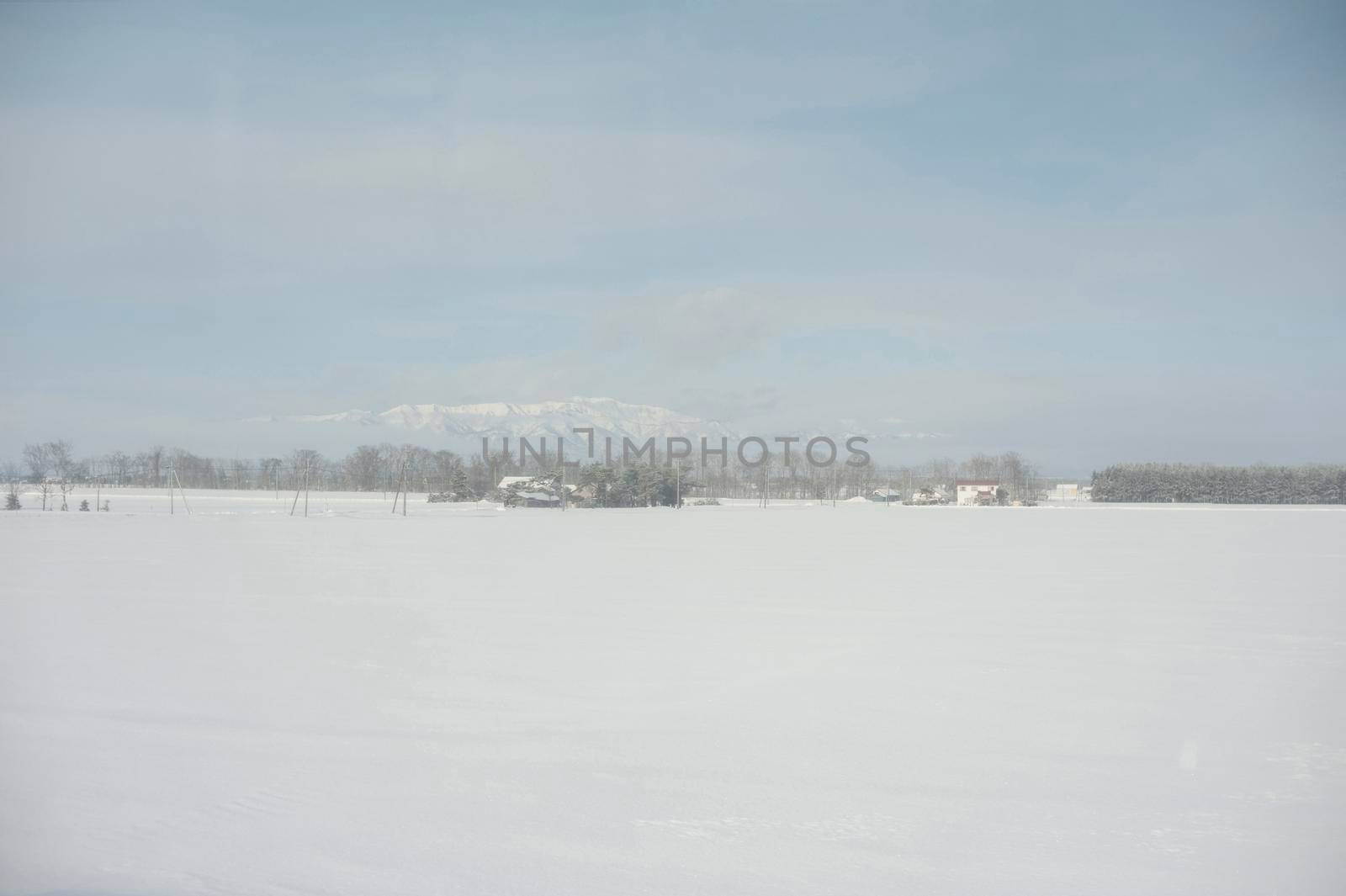 a bleak snow covered landscape, northern Japan in winter