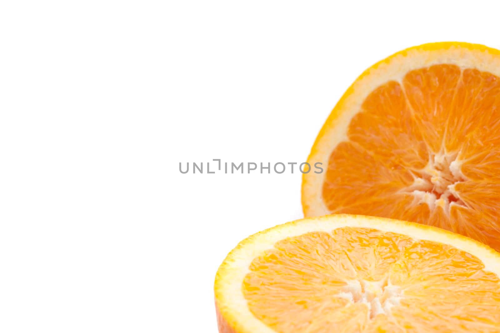 Closeup of the juicy pulp of a halved fresh orange isolated on white with copyspace