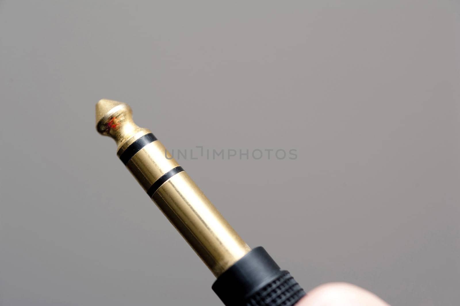 an audio jack plug or TRS connector 6.35mm or 1/4" jack