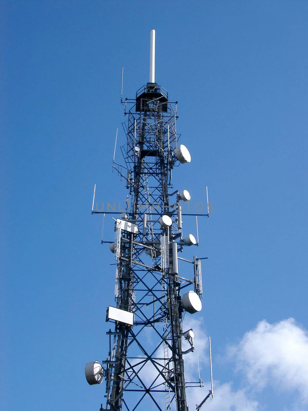 a tv transmission mast with microwave dishes