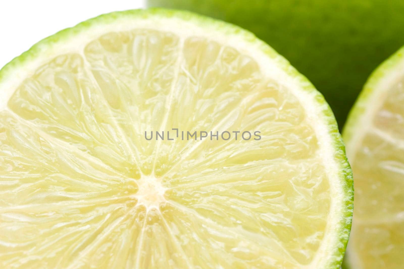 Close-up of fresh and green lemon lime halves