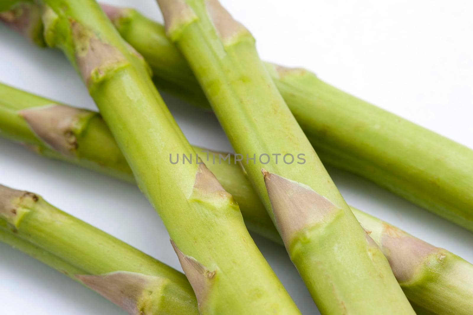Close up of fresh green asparagus shoots used as an ingredient and vegetable in cookery