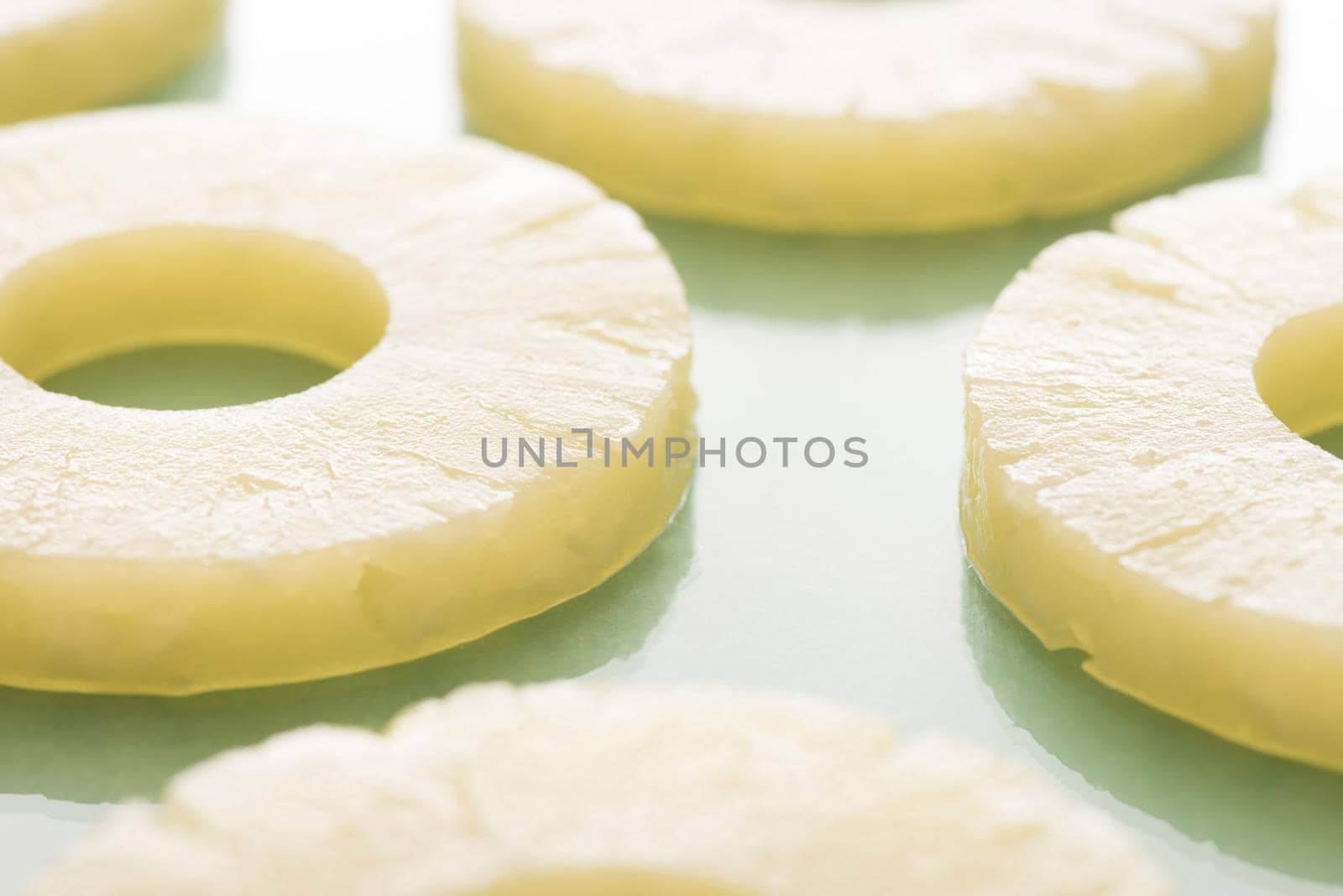 Pineapple pieces cut in slices in close-up