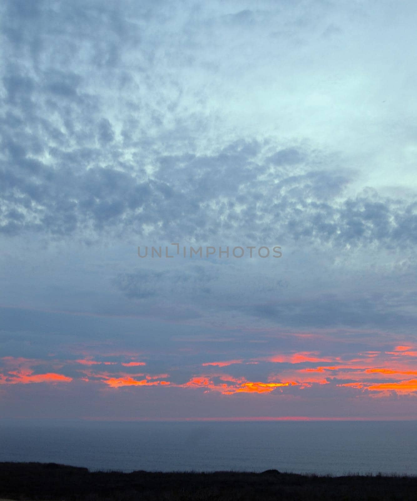 dusk sky glowing red with a fiery sunset